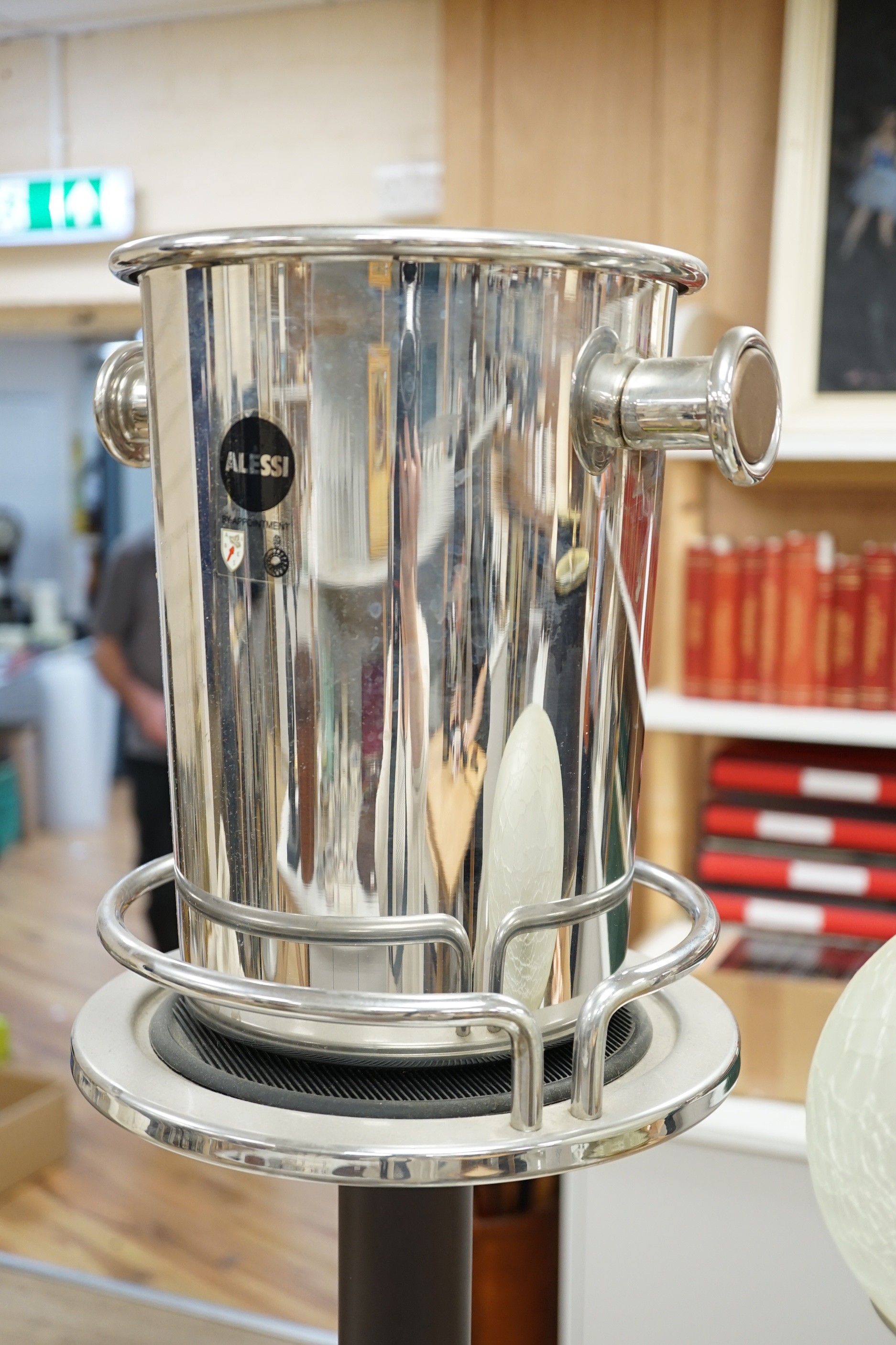 Two Laurent-Perrier ice buckets, an Alessi wine cooler and a wine cooler stand. Stand height 64cm